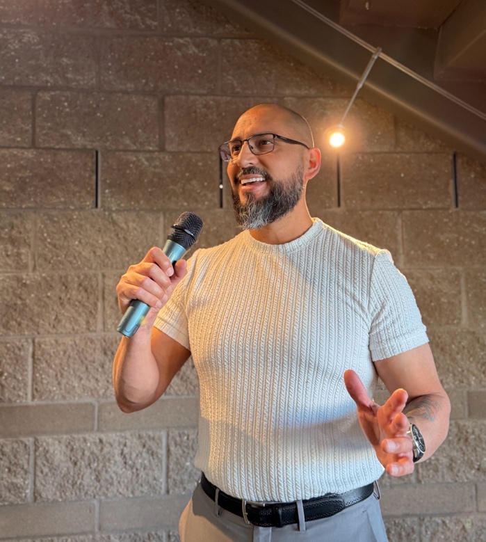 F. John Gamez III speaking at a live event
